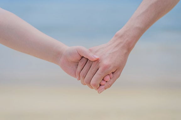 To Alleviate Pain, Hold the Hand Of A Loved One